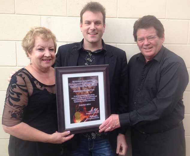 Auckland magician Mick Peck presented with special Magic New Zealand award from Alan and Michele Watson